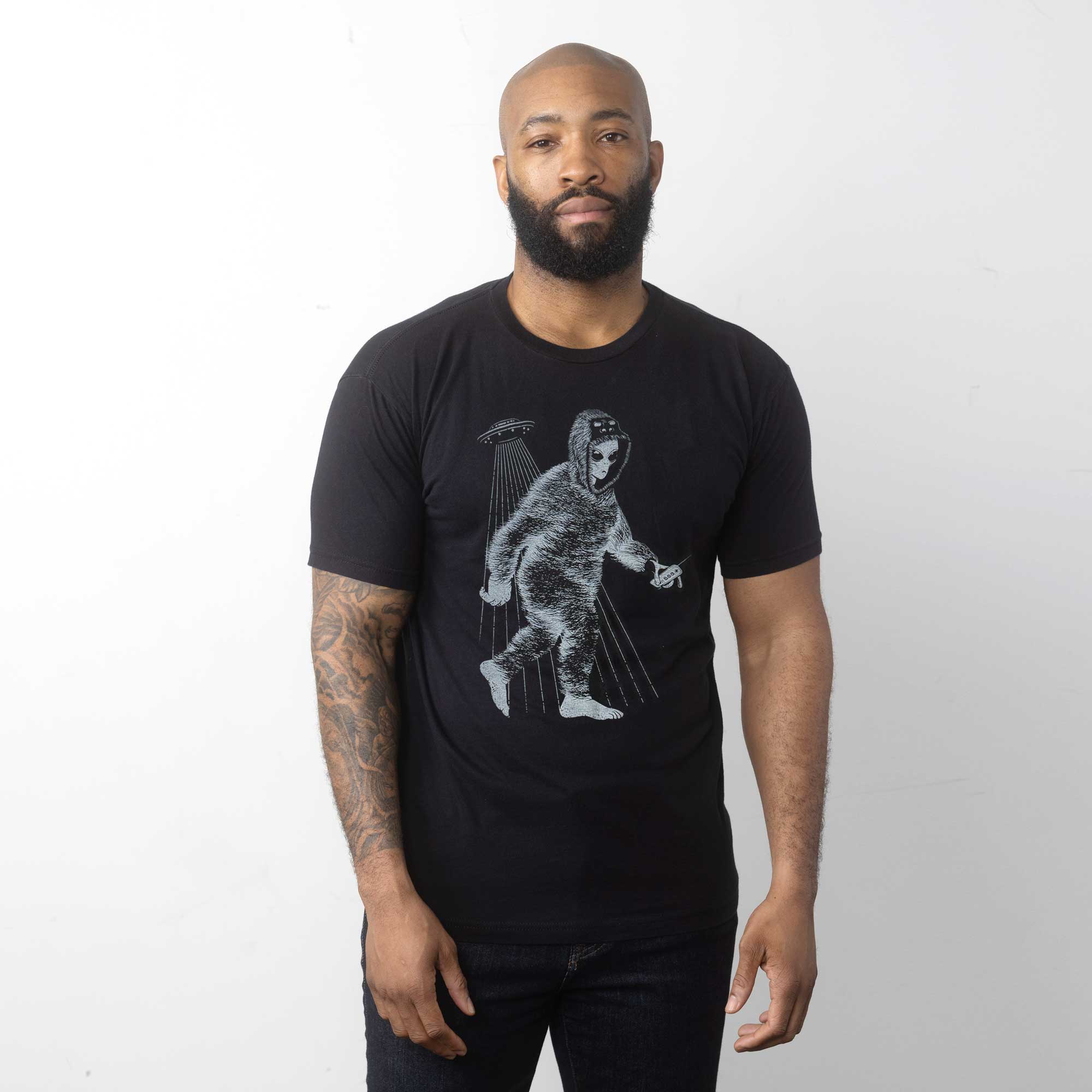 Graphic t-shirt of alien in Bigfoot suit - STORY SPARK
