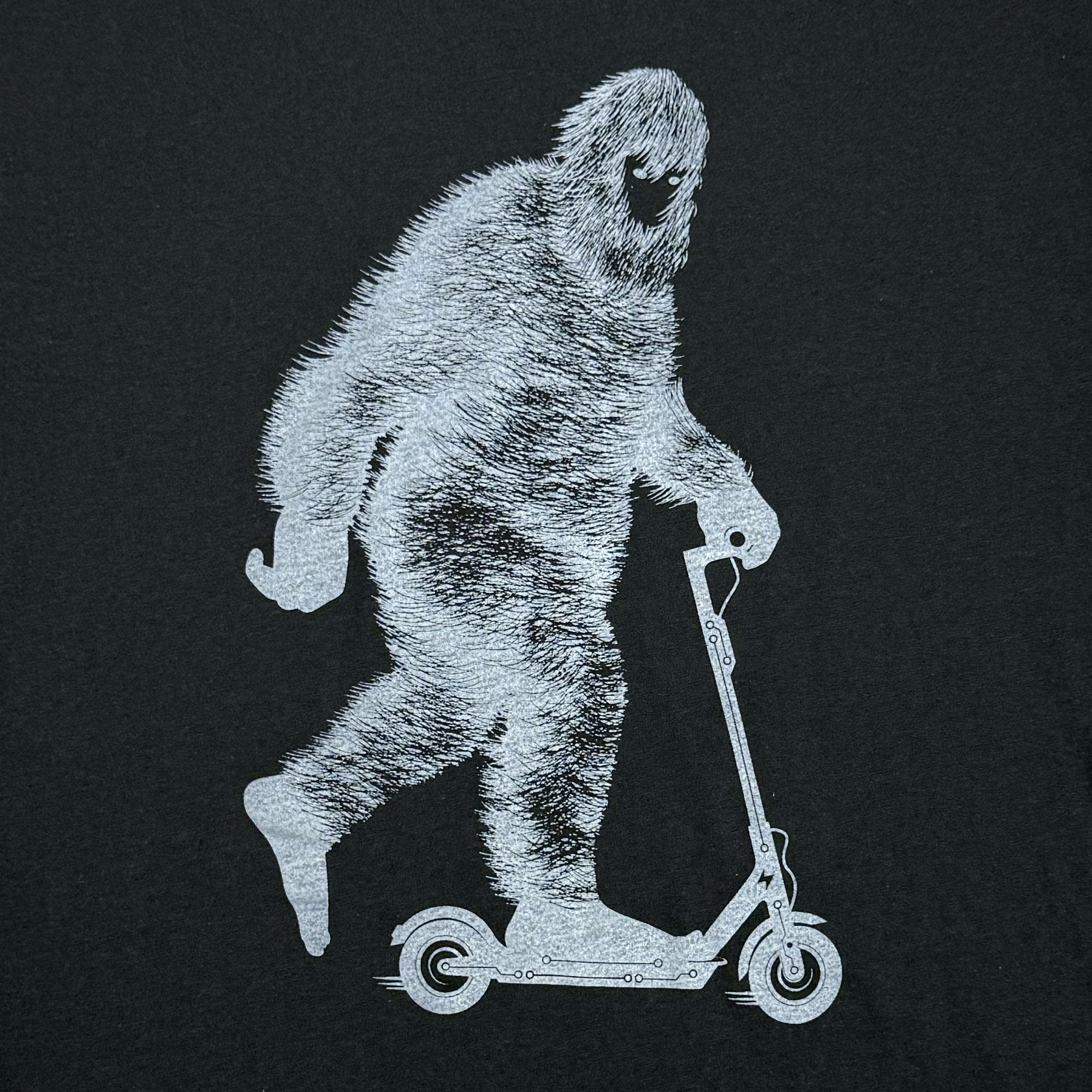 Scooter riding Bigfoot t-shirt in black that glows in the dark - STORY SPARK