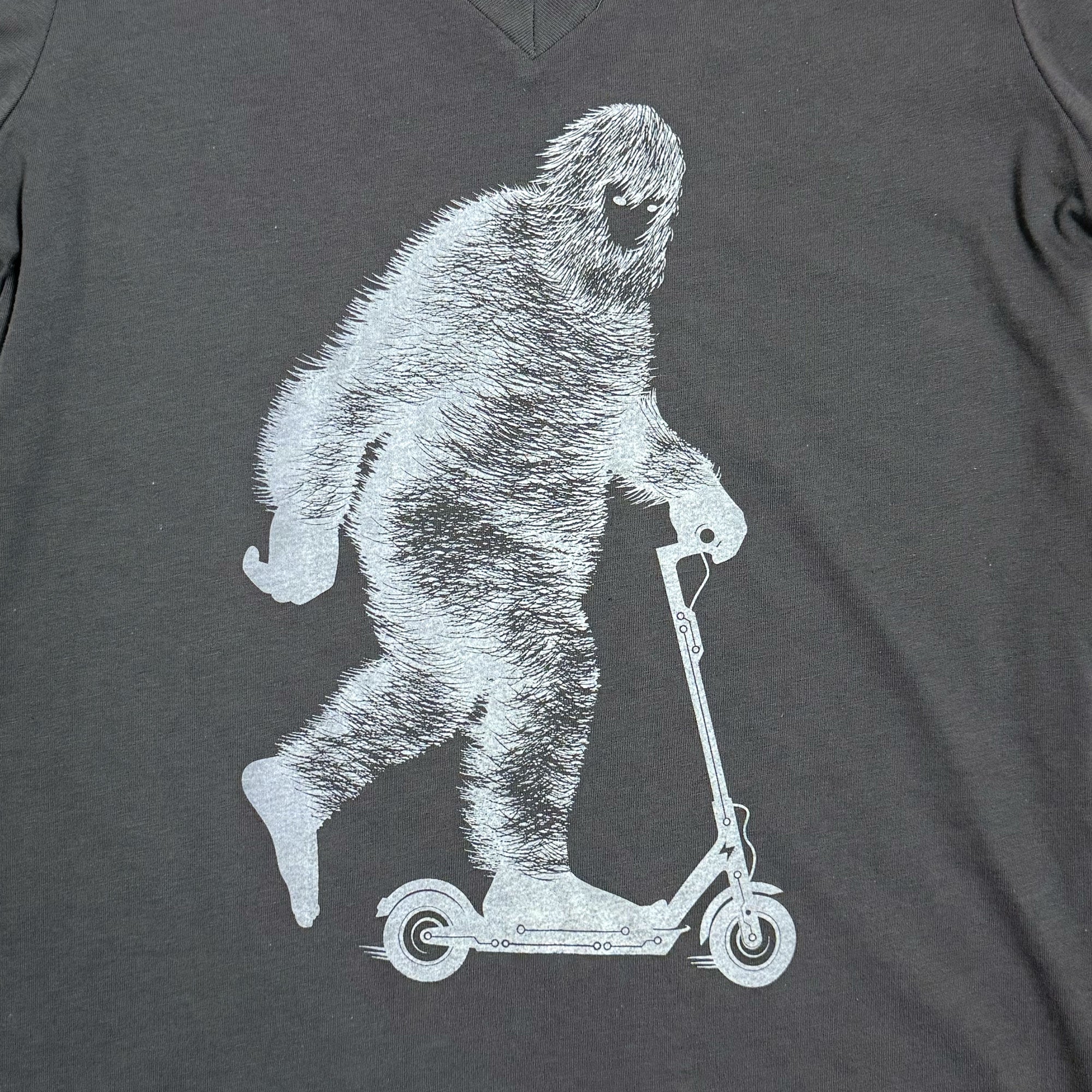 Scooter riding Bigfoot womens graphic t-shirt