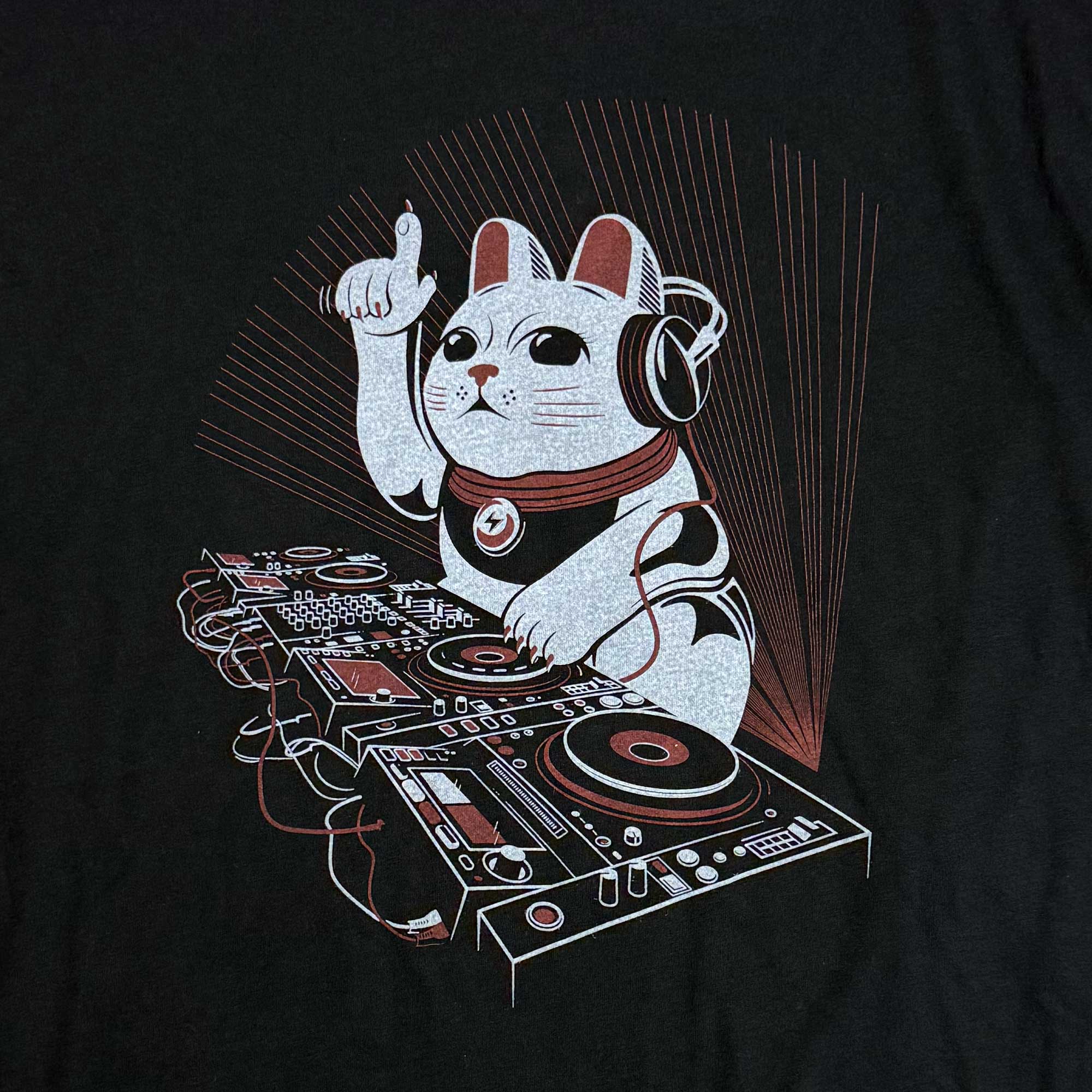 Black t-shirt with a graphic of a cat DJing on a turntable