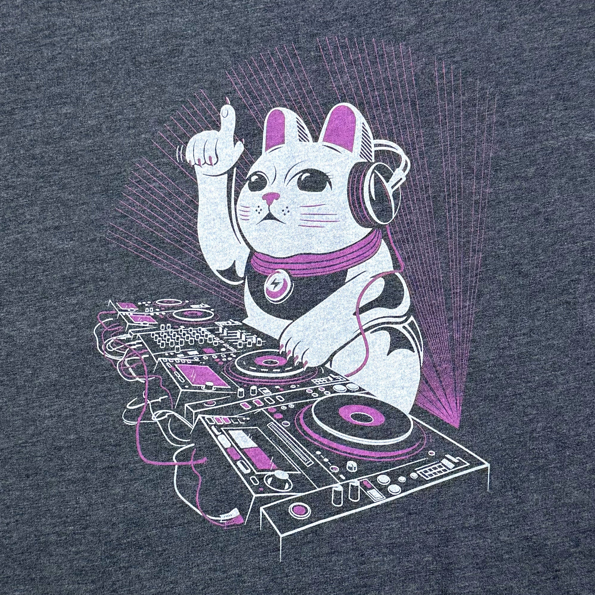 Cat DJing on a turntable with headphones on a dark navy womens t-shirt.