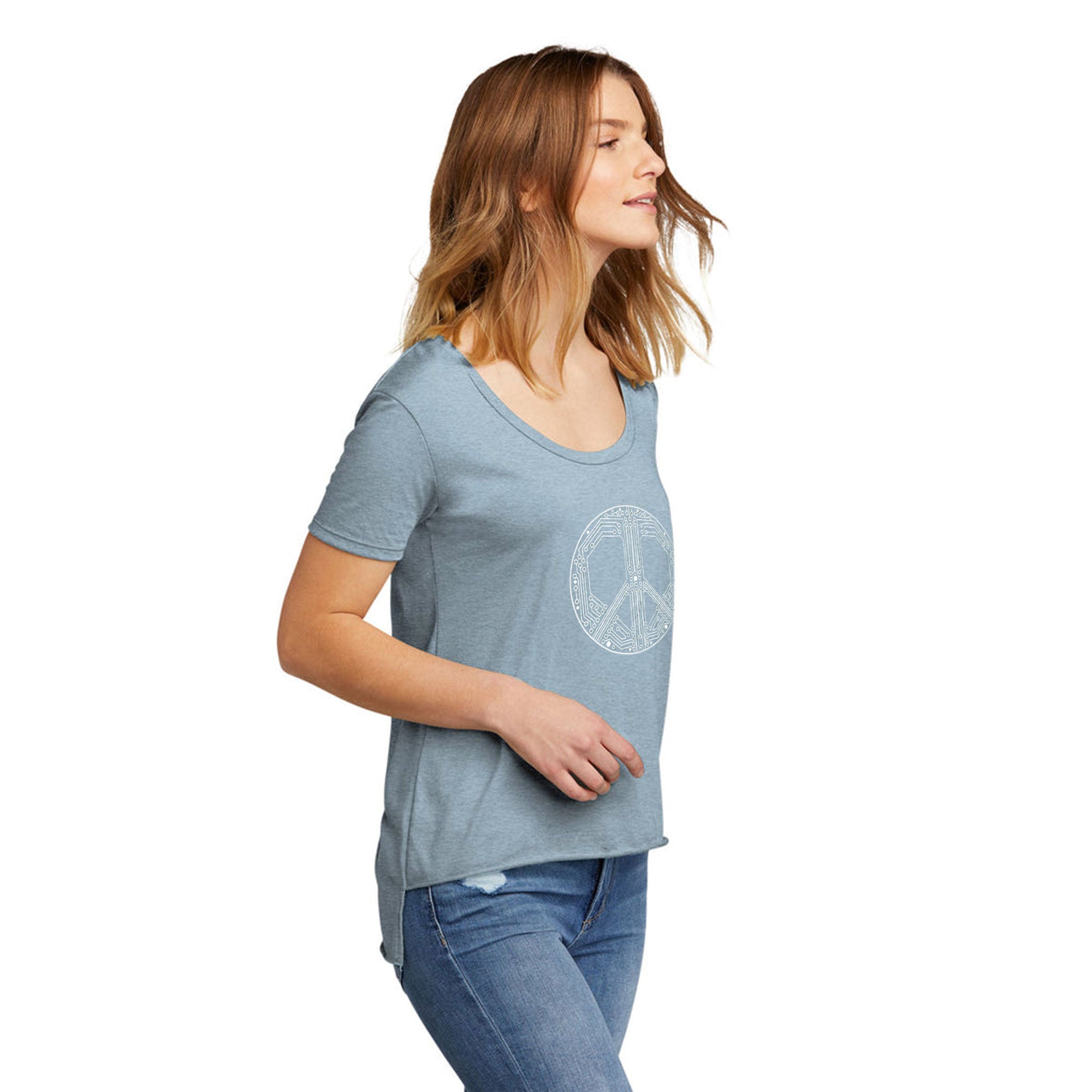Woman wearing a blue t-shirt with a peace symbol design on a white background