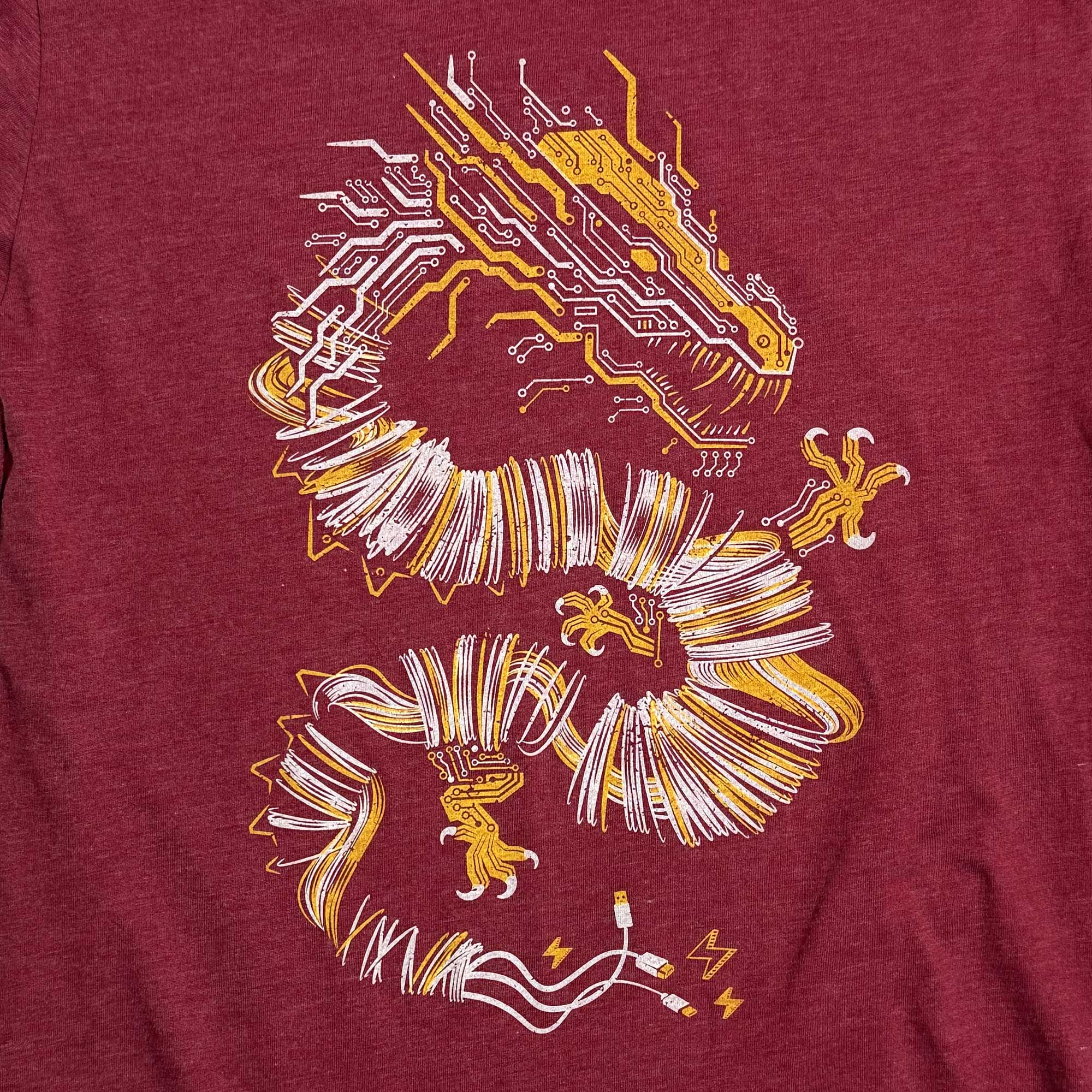 Red graphic t-shirt with a gold and white graphic design of a cyber dragon