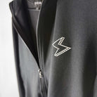 Full zip black jacket with metallic STORY SPARK logo