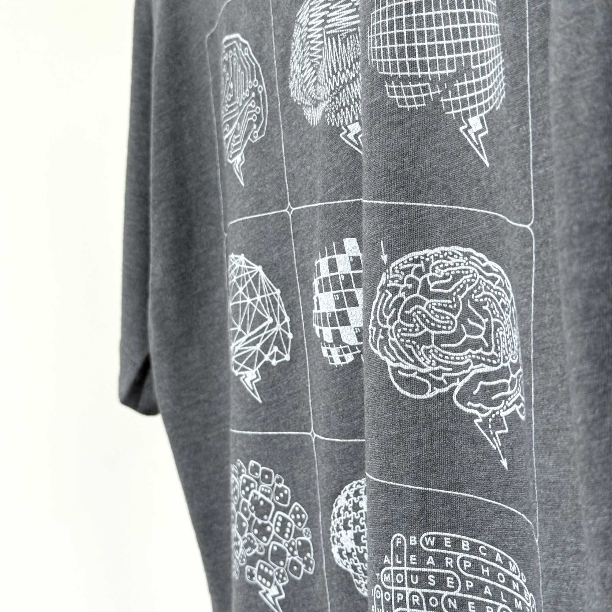 Gray t-shirt with white geometric brain design on a plain background