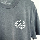 Gray t-shirt with a white crossword puzzle brain design screen printed on the upper left chest