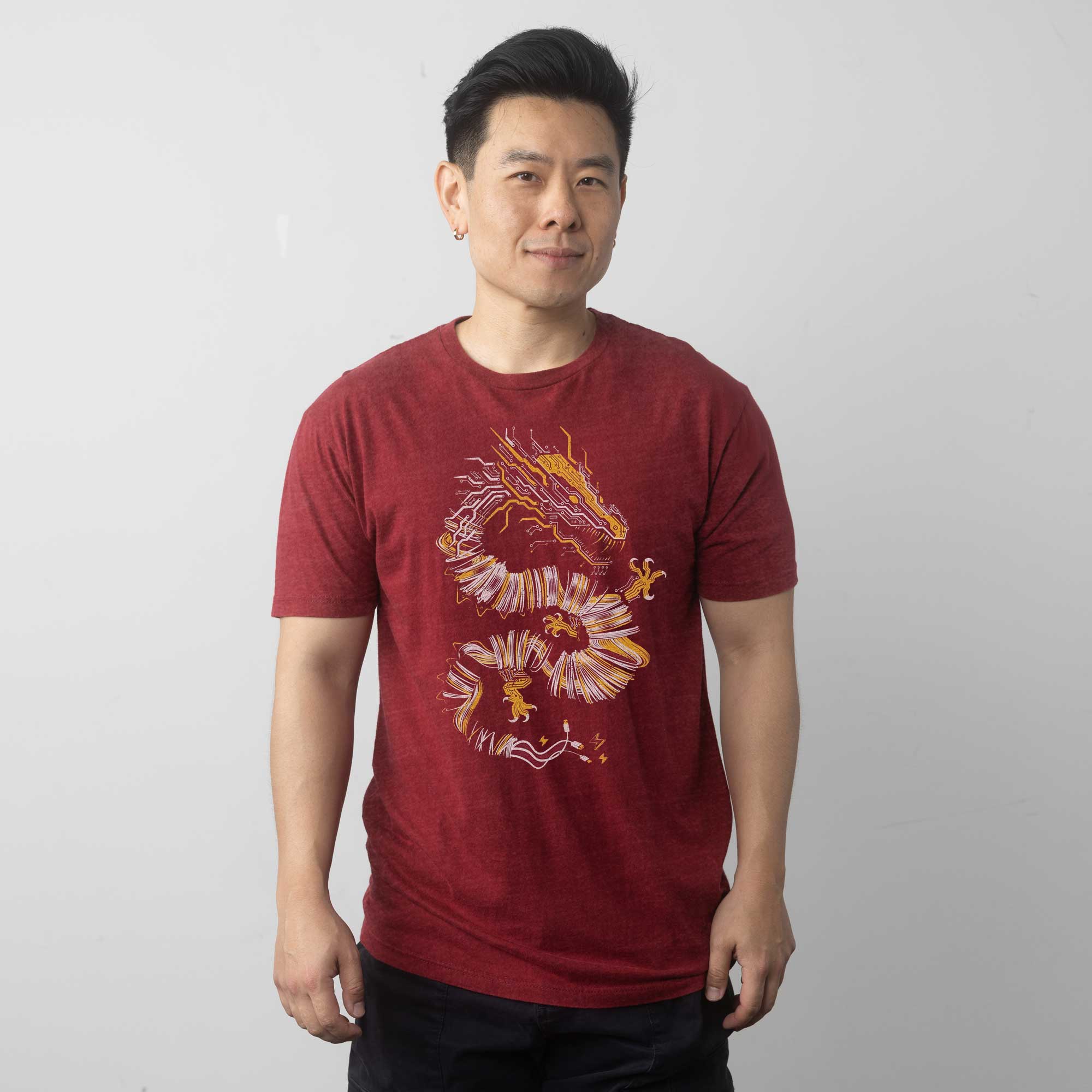 Man wearing a red t-shirt with a cool dragon design by STORY SPARK